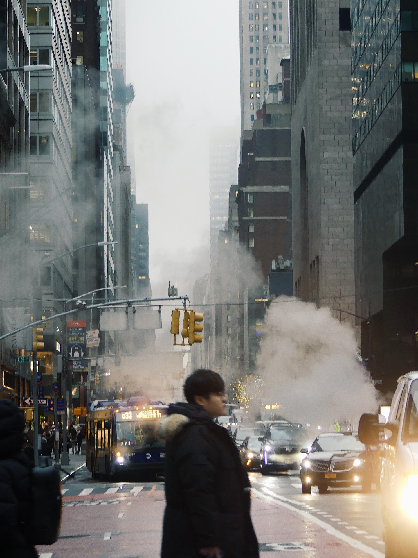 New York street with steam rising between buildings.